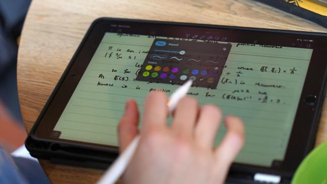 Image of Student using an iPad