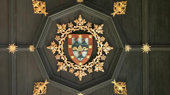 Detail from the Gate tower ceiling showing College crest