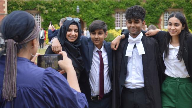 Students posing for photographs on Graduation day